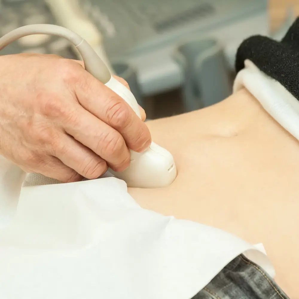 An ultrasound probe being used on a patient's neck